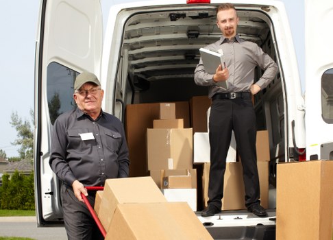 Removal van and moving team preparing a home move in Kennington