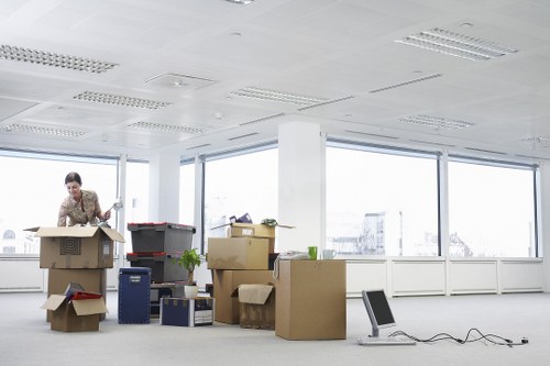 Packed boxes and furniture ready for house removals in a Kennington flat