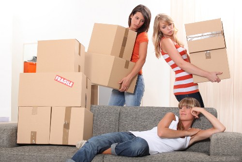 Moving crew handling stairs and access in a Kennington apartment building