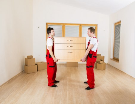 Professional movers loading household items for a Kennington relocation