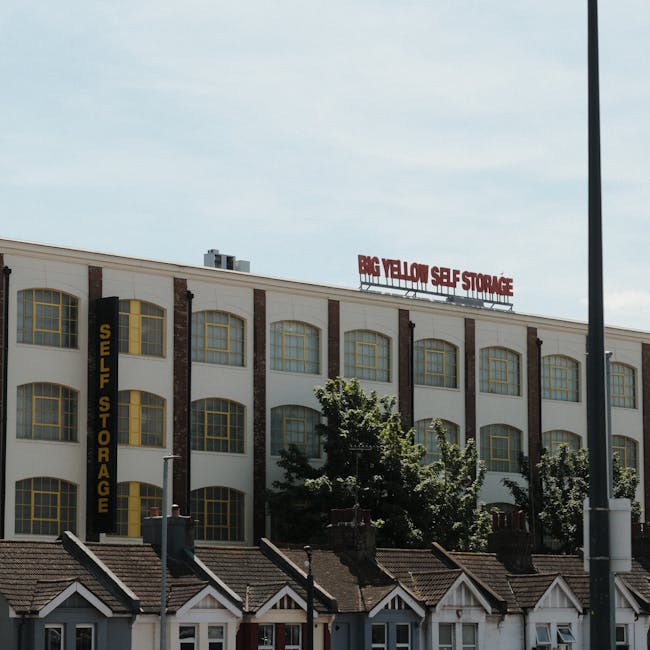 A rectangular, white metal street sign mounted on a red brick wall displaying the text 'Welcome to South Kensington SW7' in black and red lettering. The sign is positioned at approximately eye level a